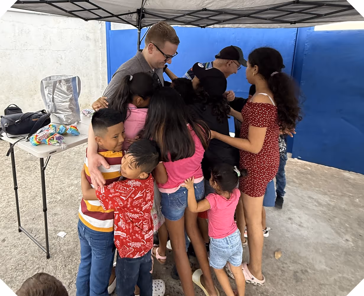 a group of kids hugging in Panama