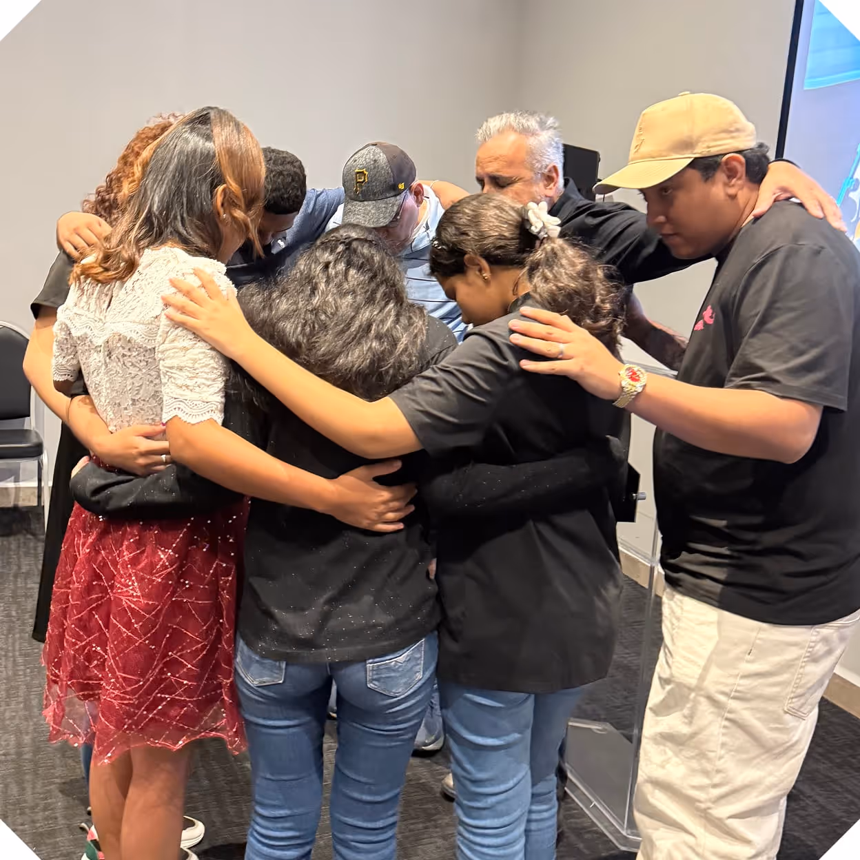 a group of people hugging each other