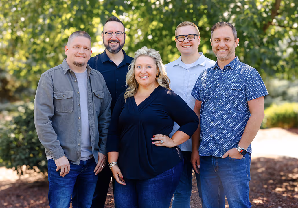 The five campus and executive pastors standing together