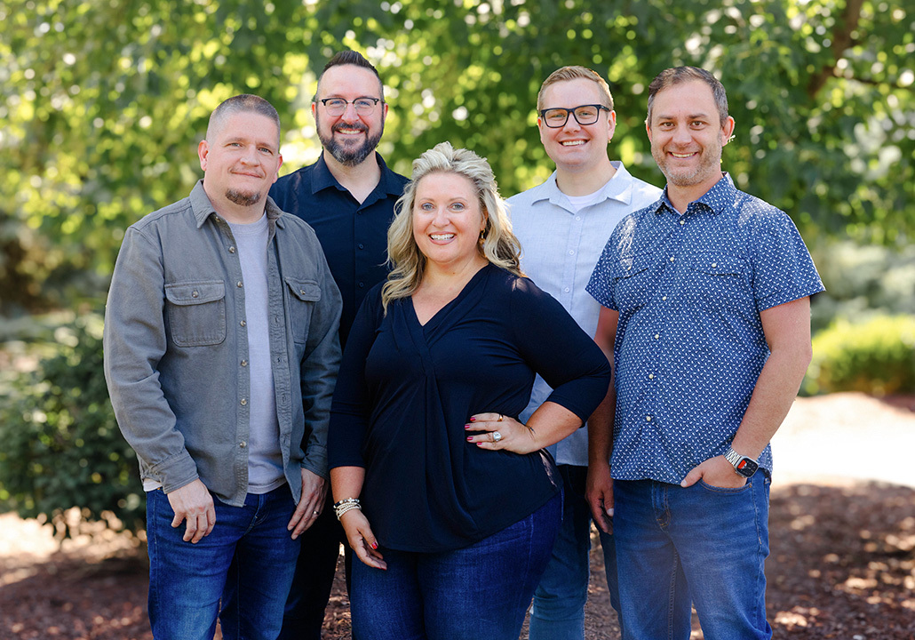 The five campus and executive pastors standing together