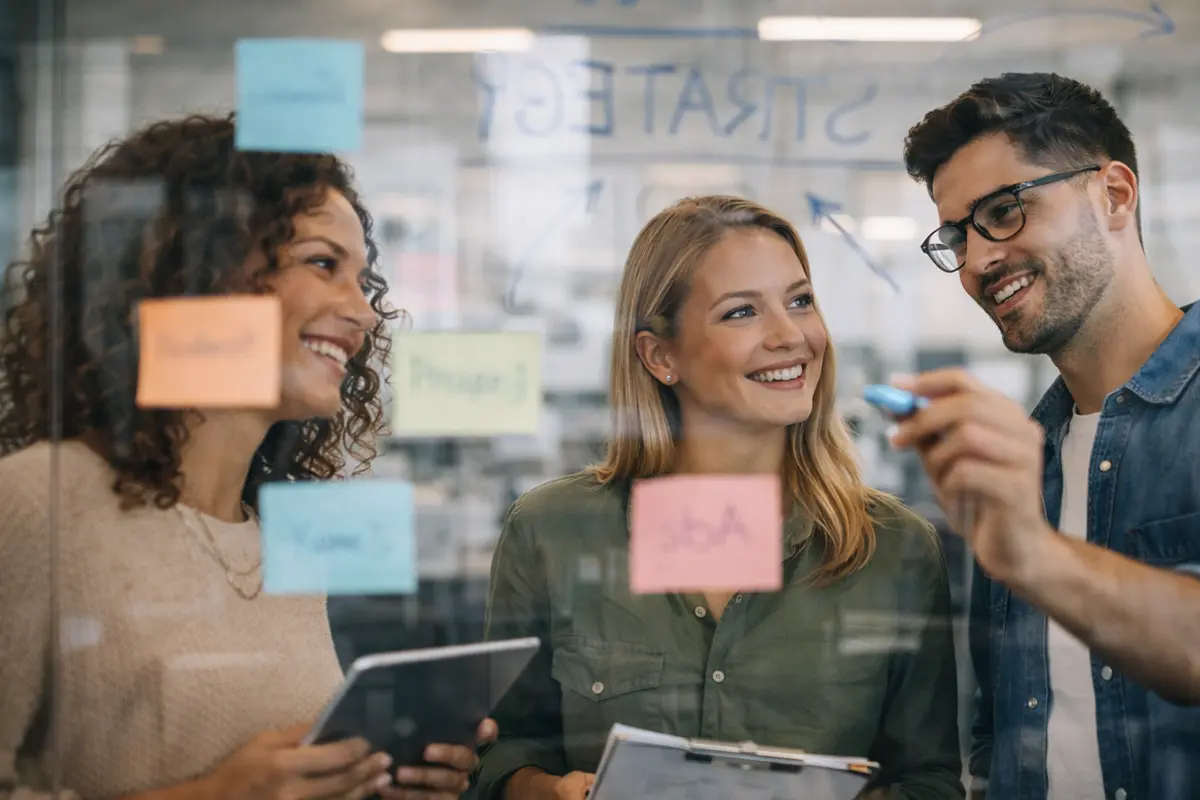 Young professionals review a physical therapy marketing plan for 2026