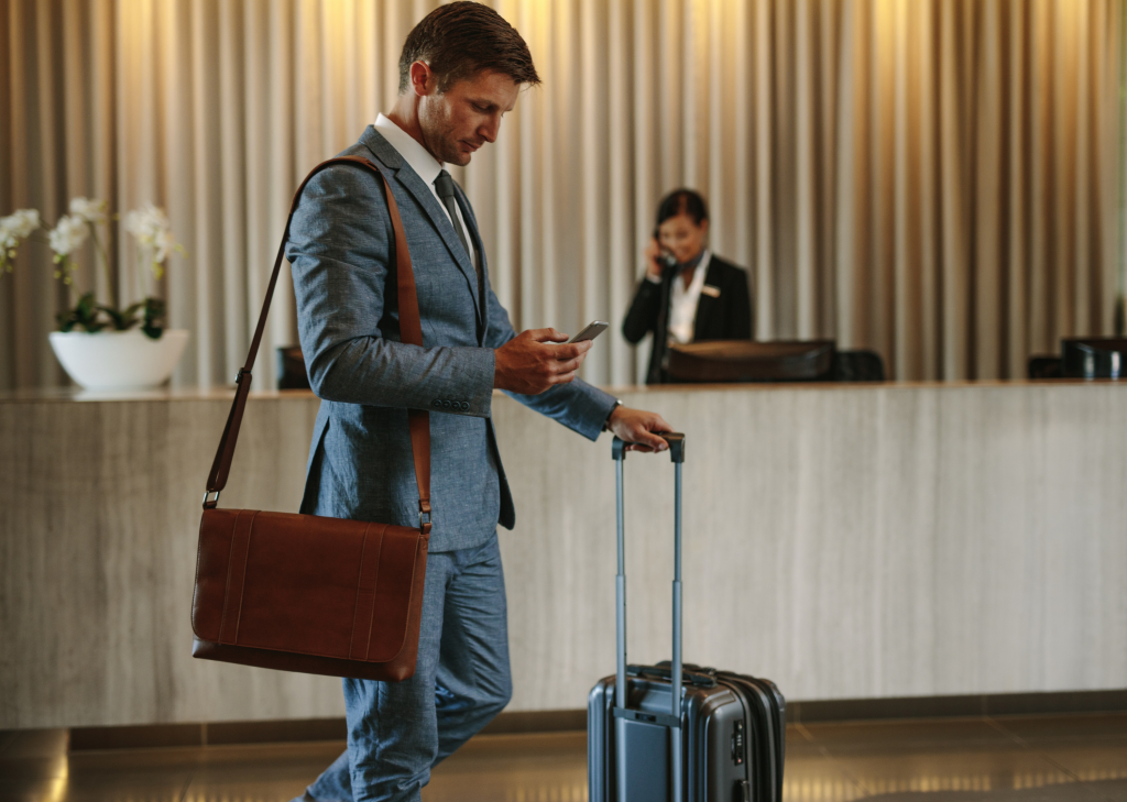 Business traveller arriving at a hotel reception