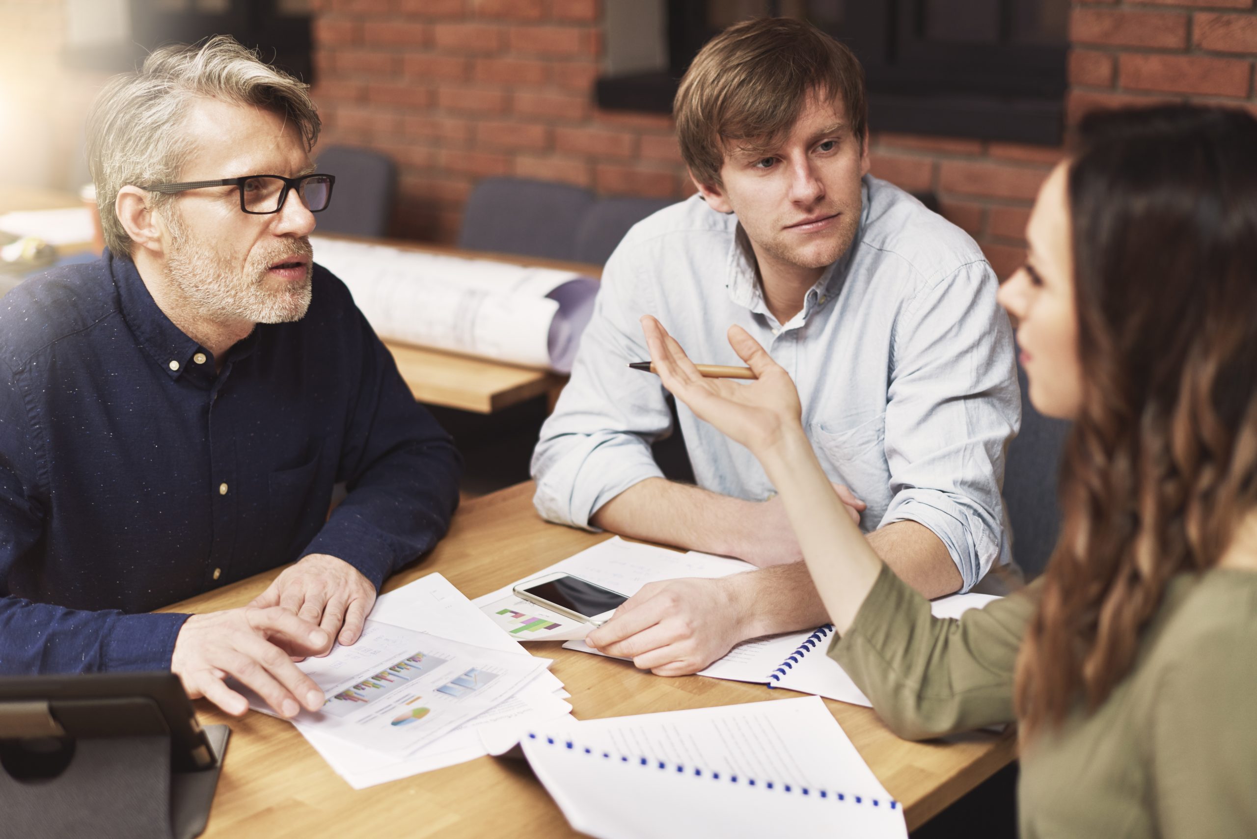 Team analysing model performance data together while raising capital for an AI startup