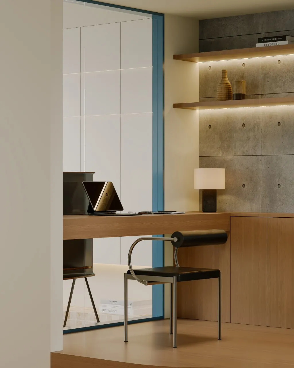 Modern minimalist workspace with black chair, wooden desk, wall-mounted shelves, and a small lamp.