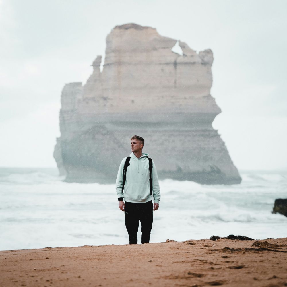 Julian Foley standing on a beach