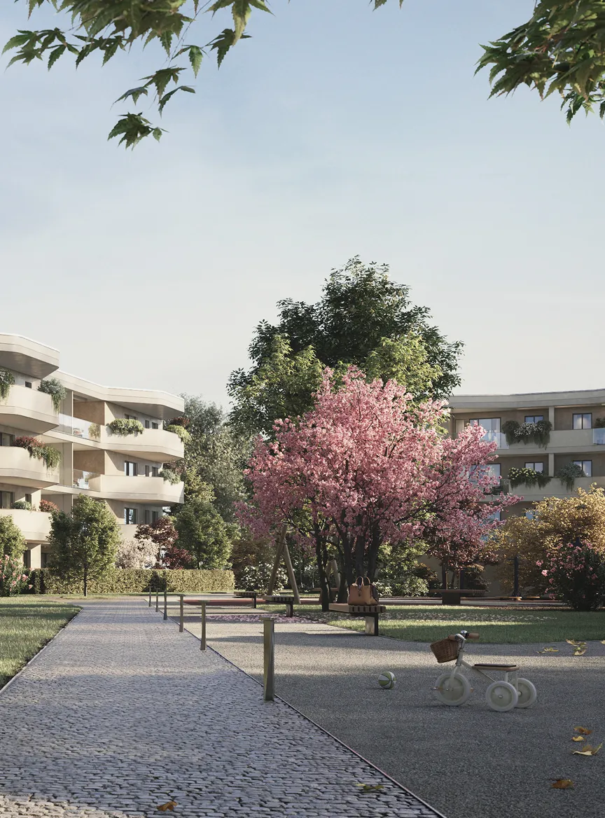 Spazio verde con sentiero in ciottoli, panchine, albero in fiore rosa e bicicletta giocattolo in un quartiere residenziale moderno.