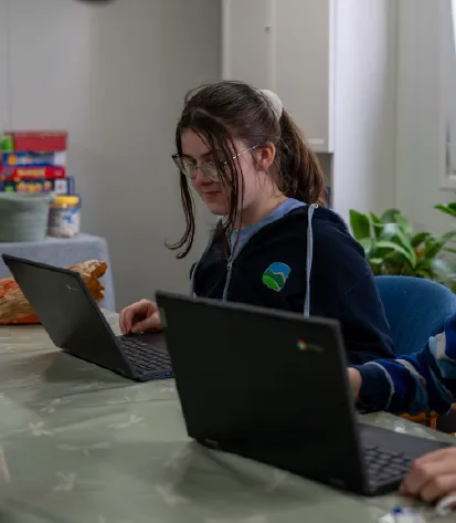 Bridge School Malvern - Pupil in uniform learning 