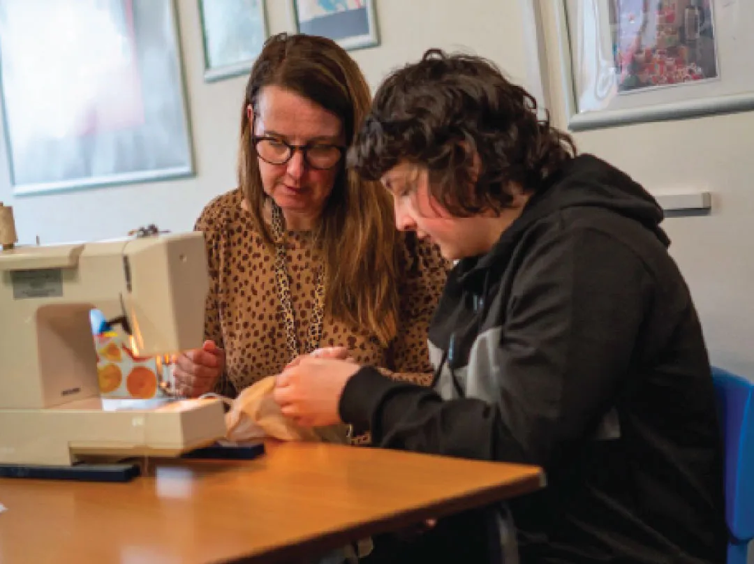 Bridge School Malvern - Teacher and pupil doing sewing crafts