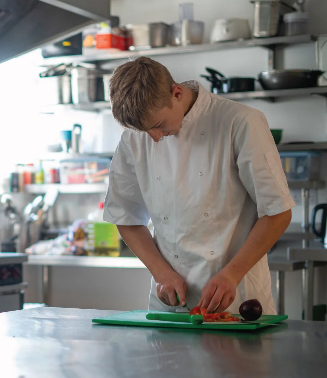 Bridge School Malvern - Student prepping food in kitchen