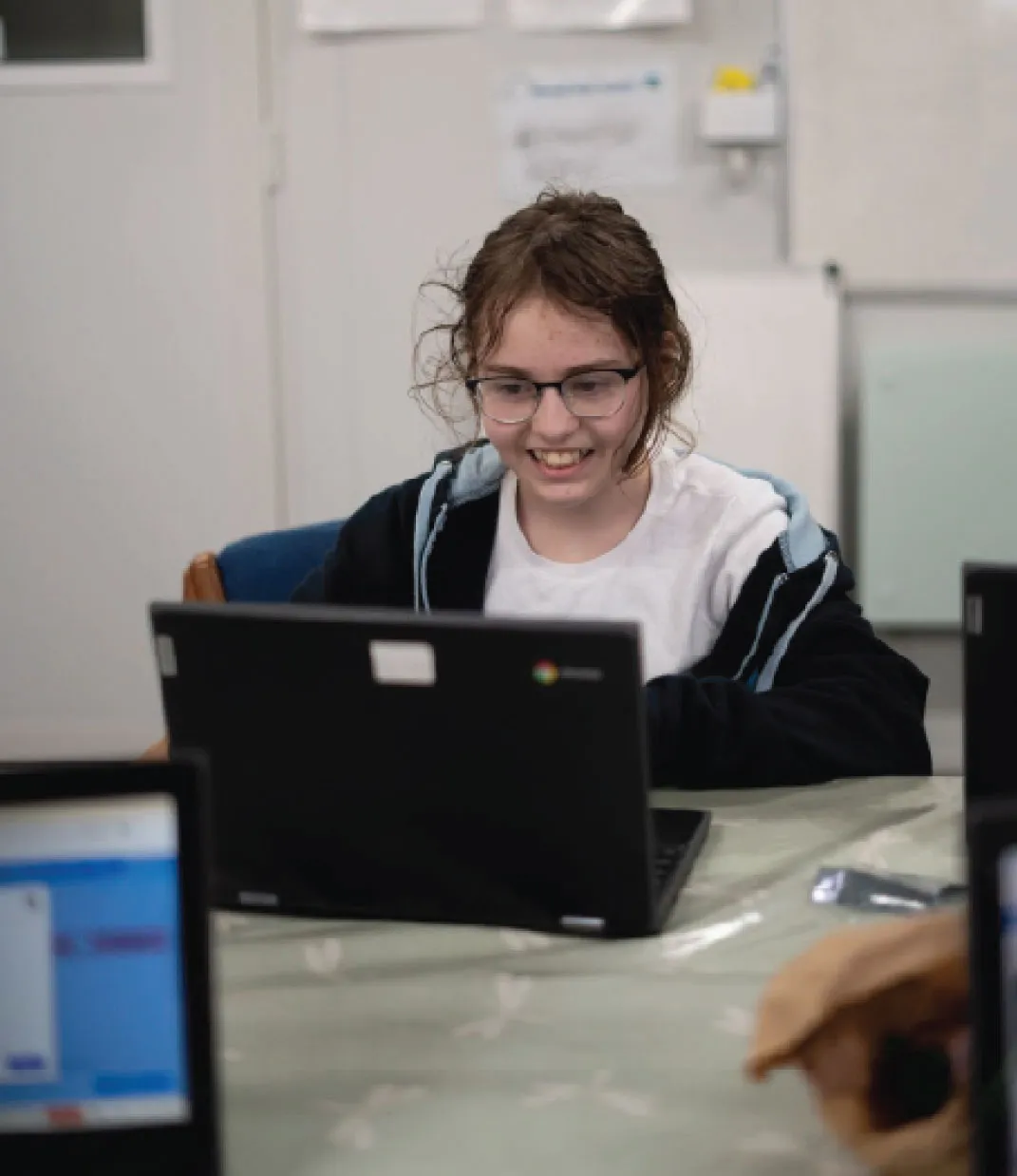 Bridge School Malvern - Pupil working on laptop 