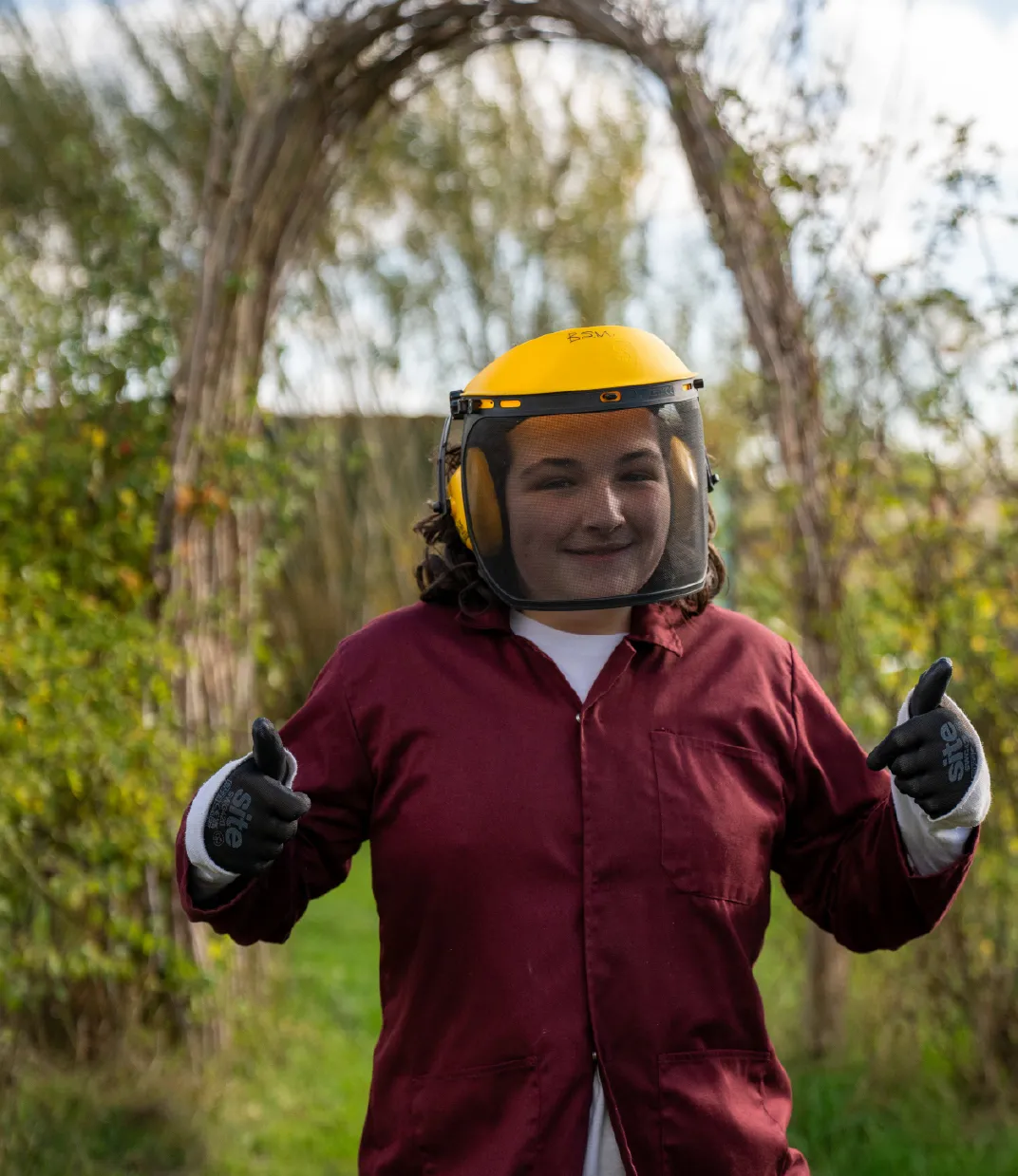 Bridge School Malvern - Student wearing safety gear in small holdings