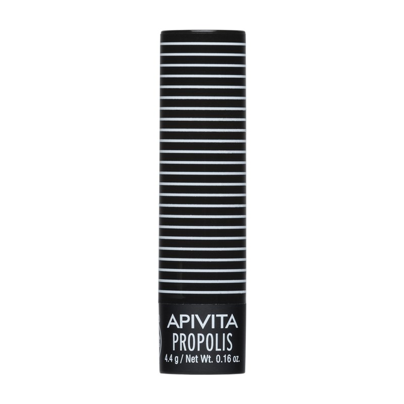 Tyčinka balzamu na pery APIVITA Lip Care Propolis v čierno-bielom pruhovanom obale.