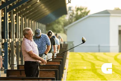A man on the golf shed