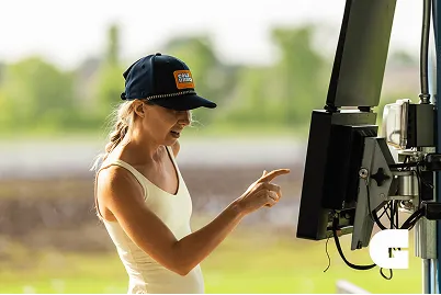 A woman touching the computer screen