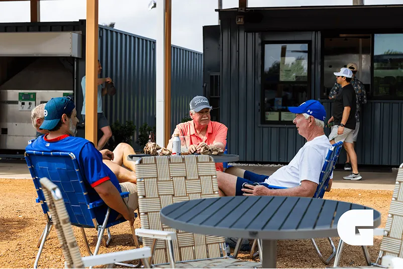 A three man talking on the side