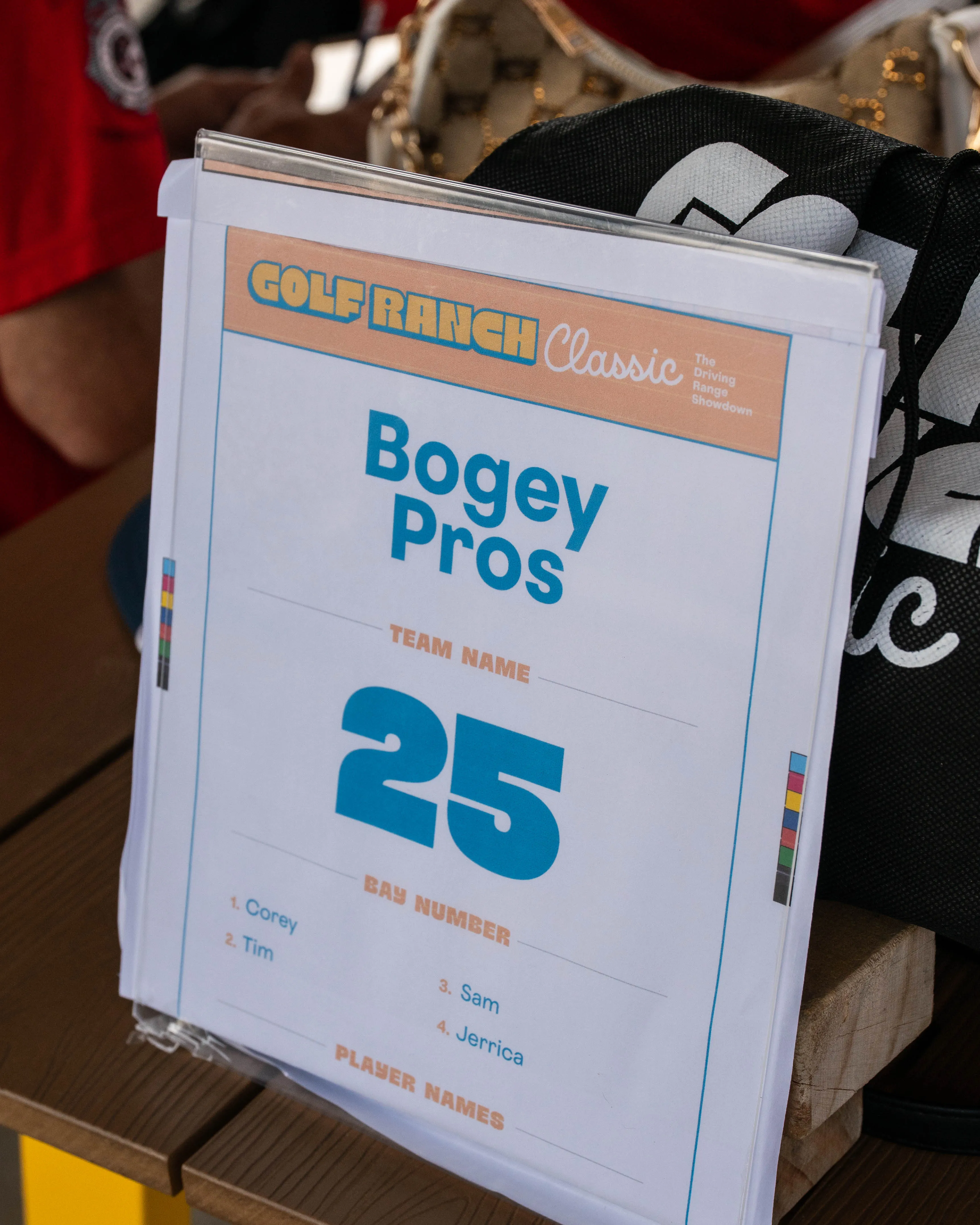 Sign for Golf Ranch Classic team Bogey Pros at bay number 25 with players Corey, Tim, Sam, and Jerrica.