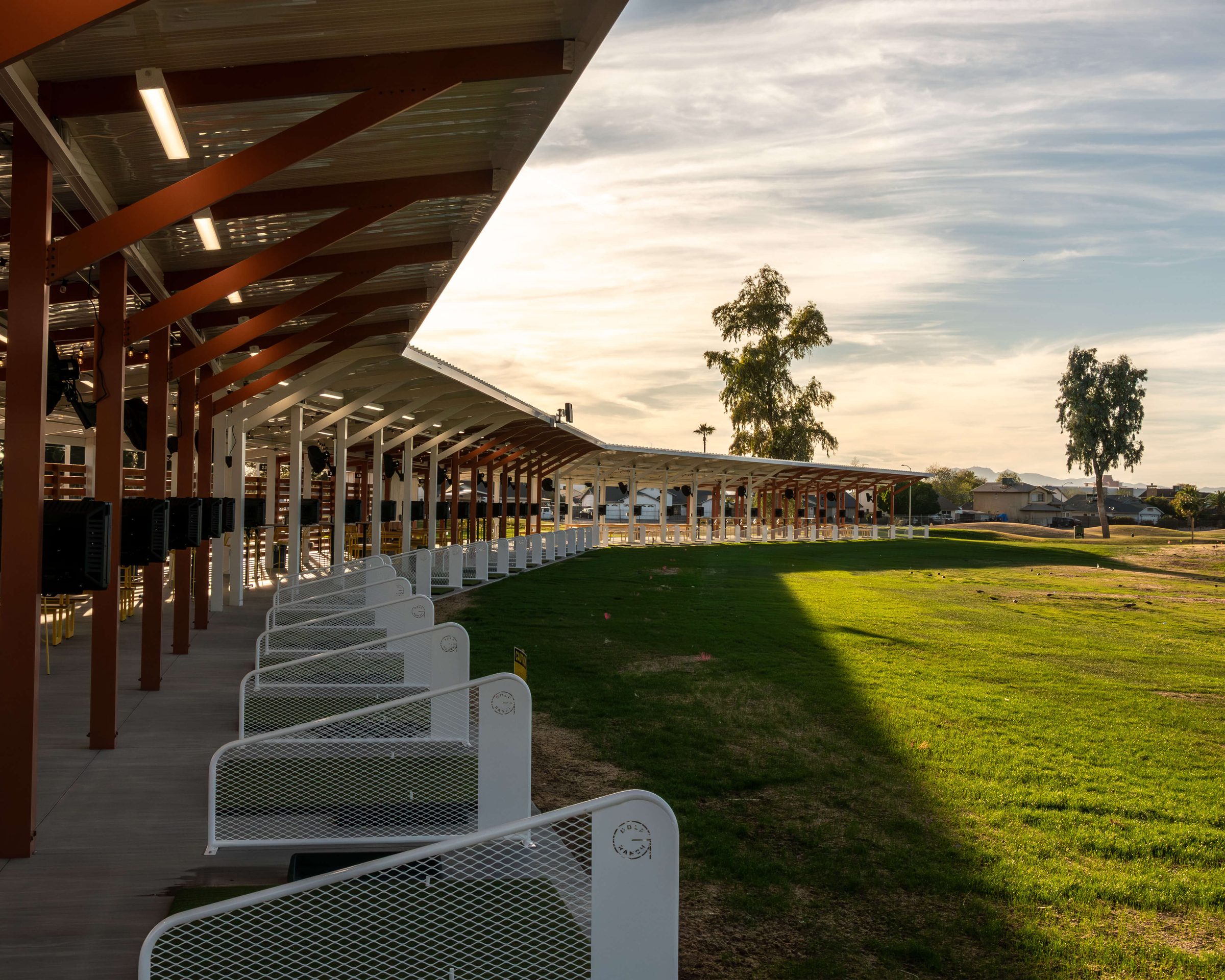 Row of hitting bays overlooking the Golf Ranch Glendale range