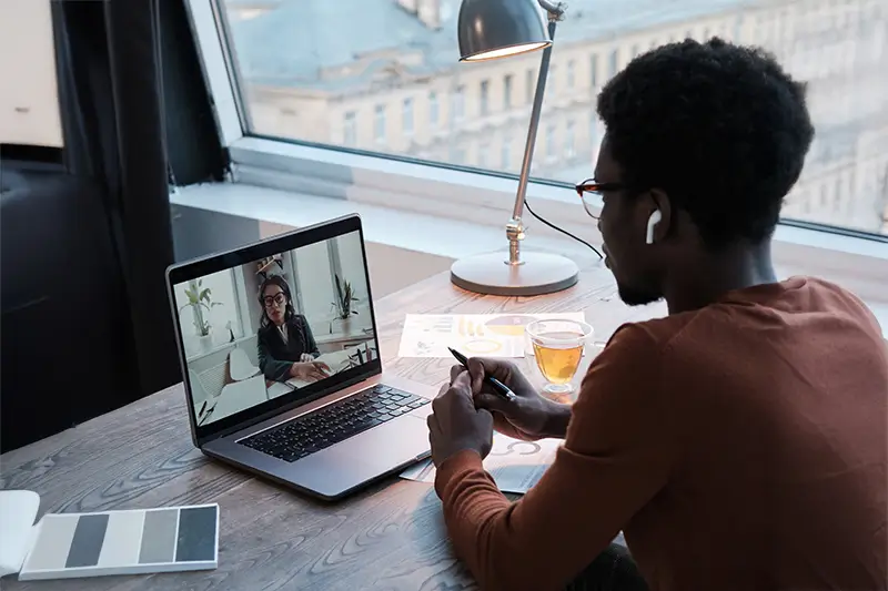 Professional conducting remote interview via video call showcasing modern RPO recruitment process for global talent