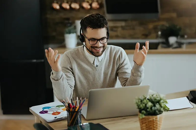 Enthusiastic remote closer conducting sales call from home office showcasing world-class talent for high-earning opportunities