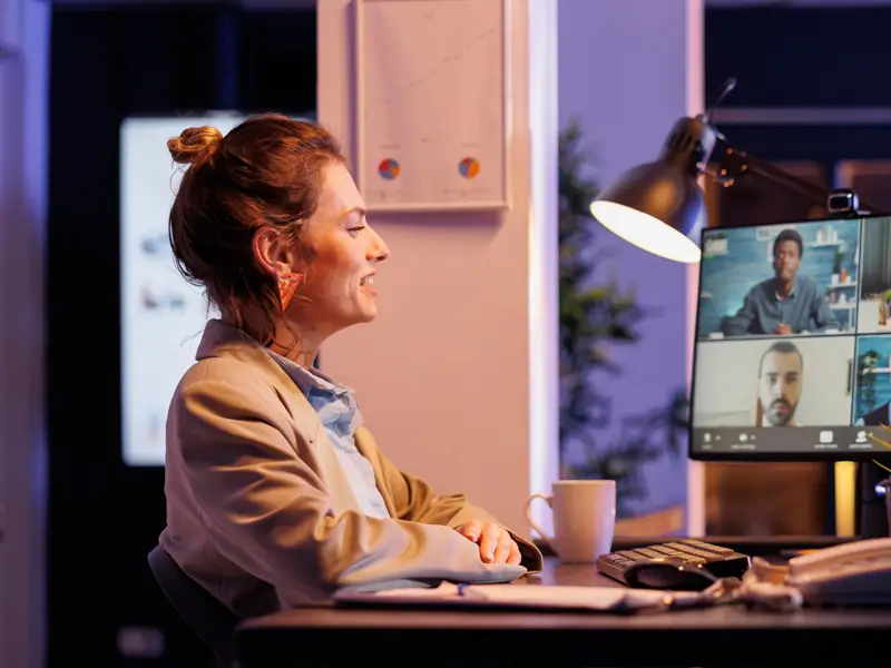 Professional woman in video conference with diverse sales candidates representing global talent acquisition opportunities