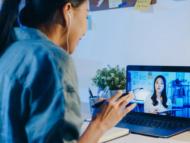 Remote recruiting professional in video consultation demonstrating client-focused talent partnership approach