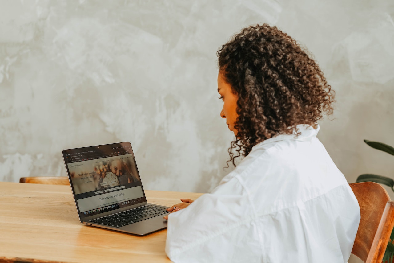 A business owner works on her website