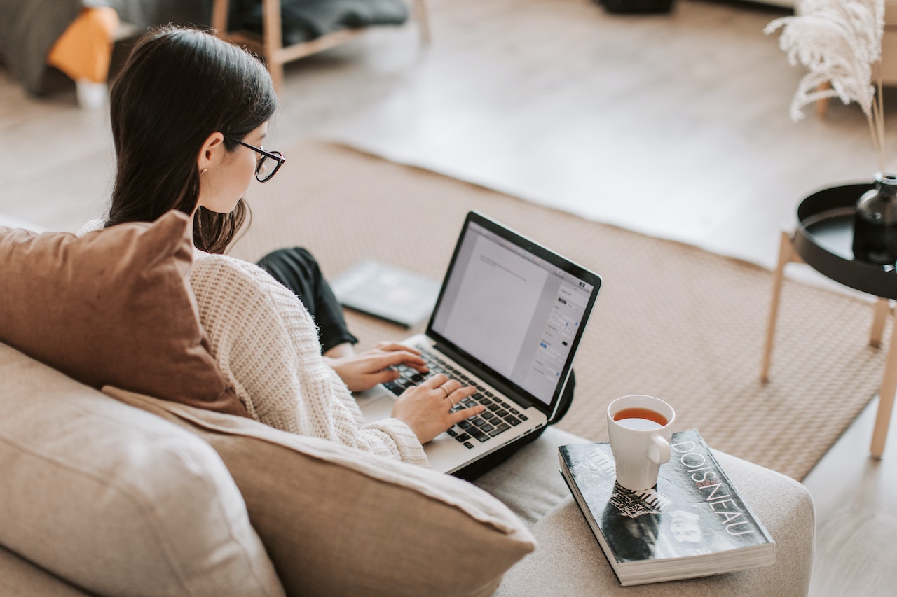 A remote employee works on their laptop