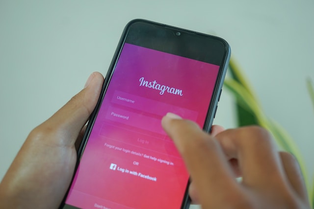 A person logging into Instagram on their phone