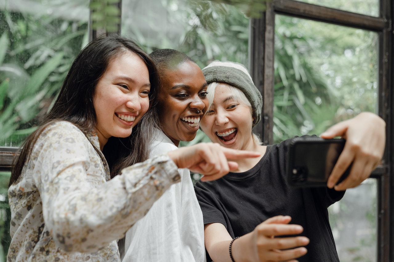 Three young women from the Philippines taking a selfie