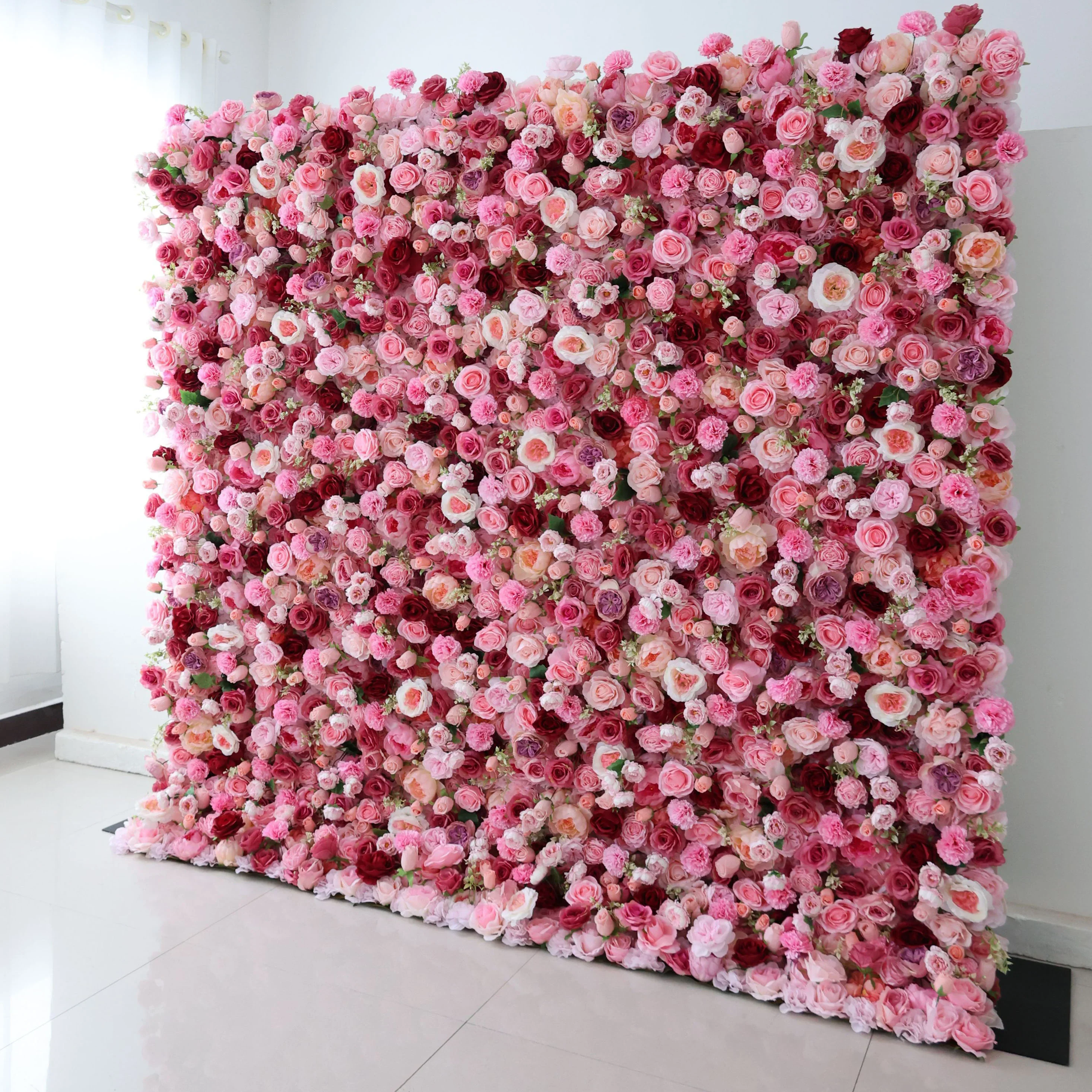Pink and red rose flower wall backdrop for a photo booth