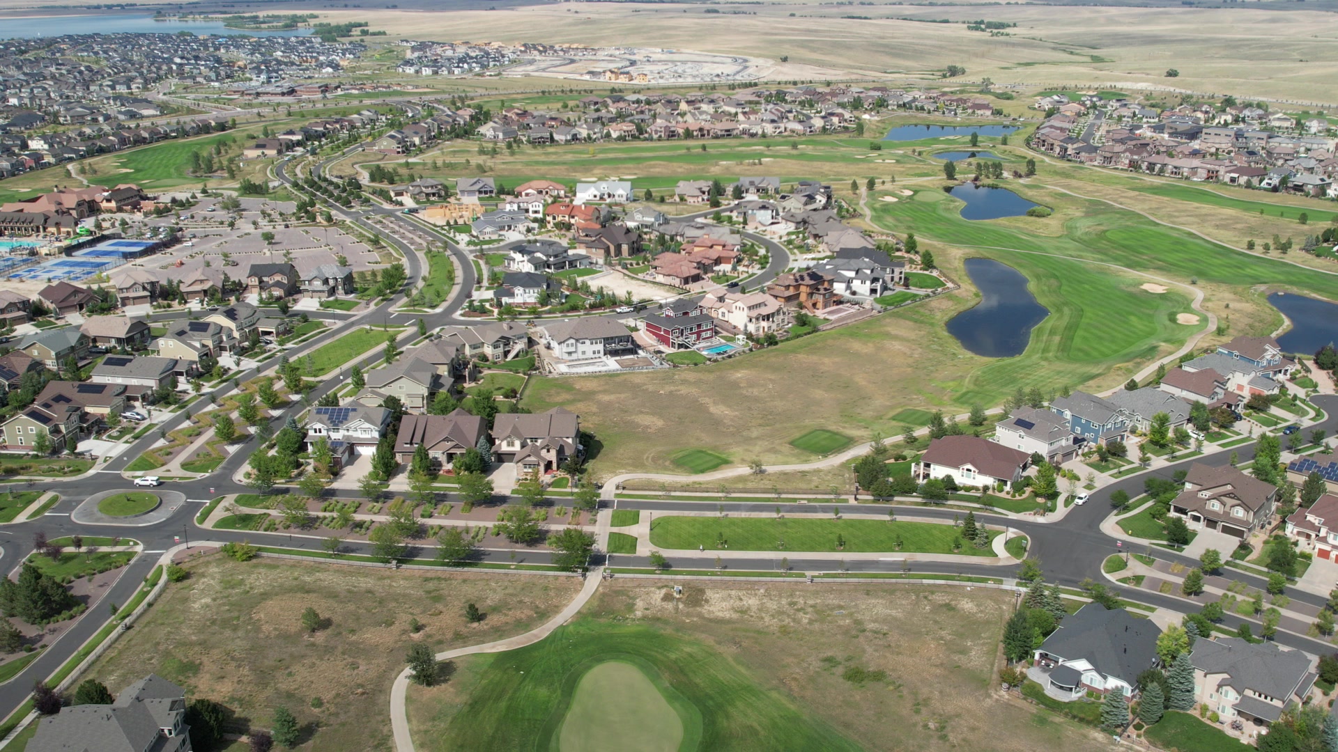 Southeast Aurora golf-course community with ponds and open space