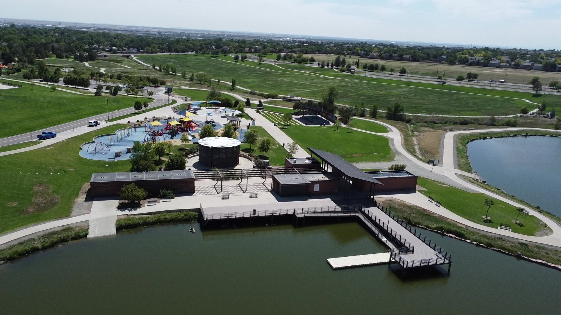 Thornton park with a lake, pool and recreation center from above