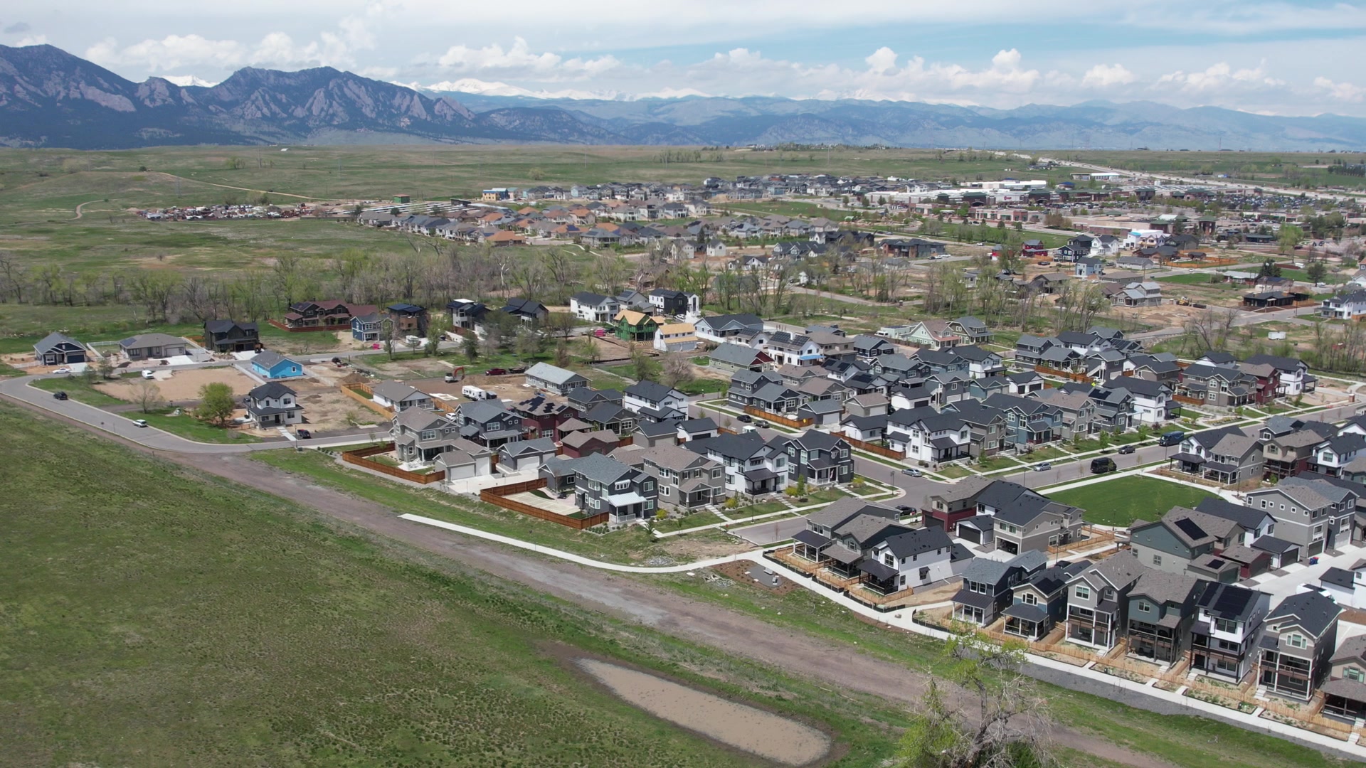 Superior's rebuilt neighborhood with the Flatirons behind