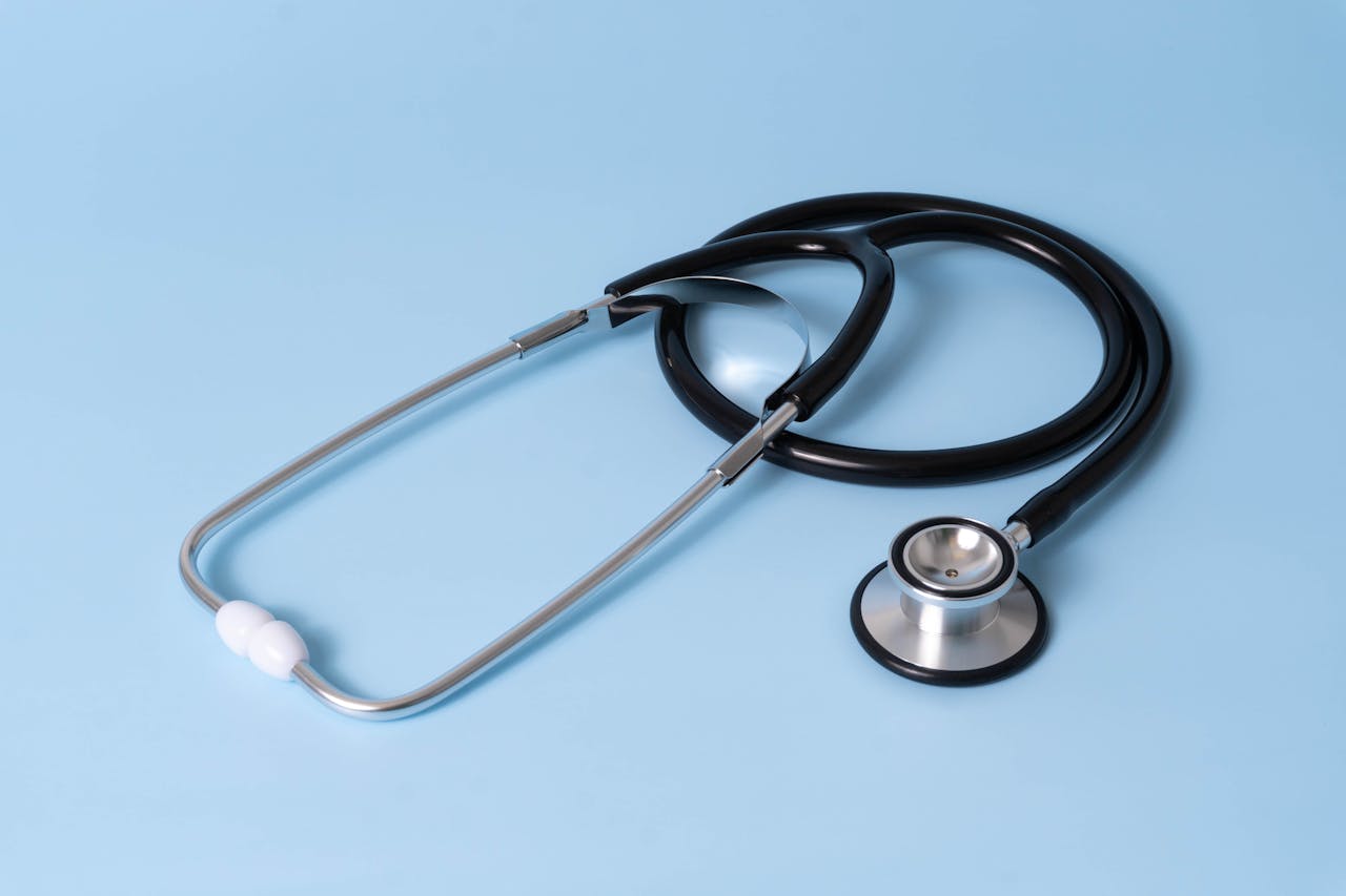 Black Stethoscope over blue background