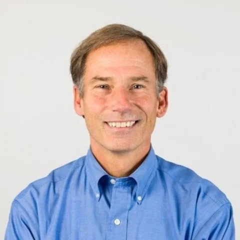 A man wearing a blue shirt.