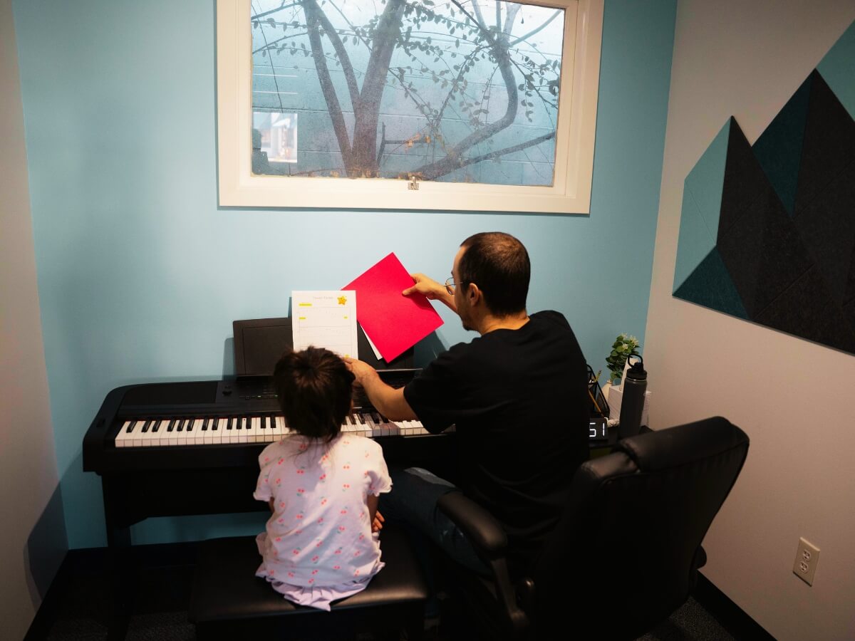 Student and teacher in private piano lesson