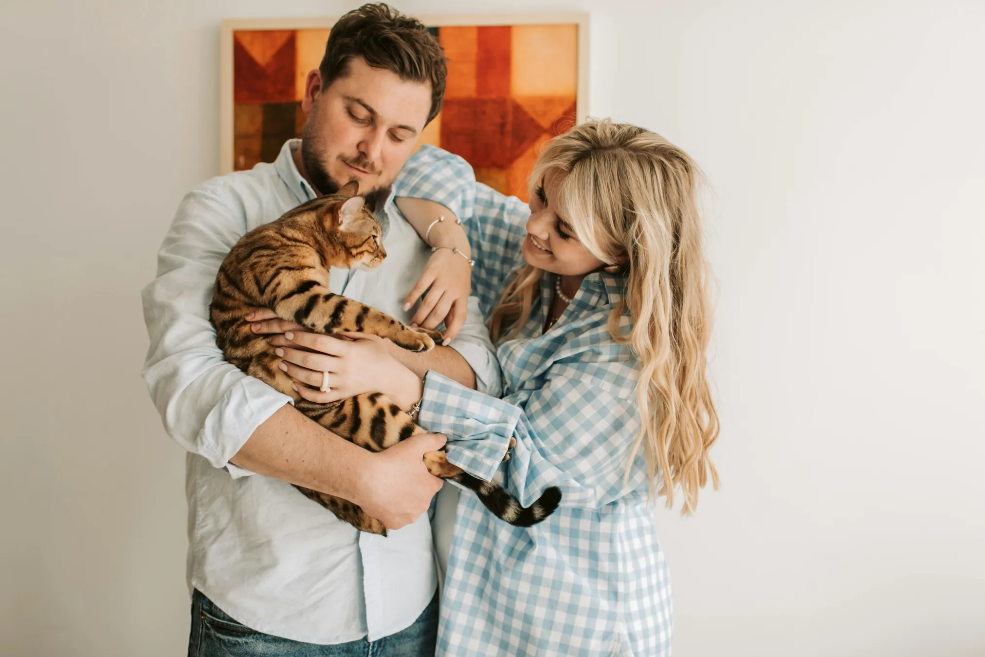 couple holding cat stock image