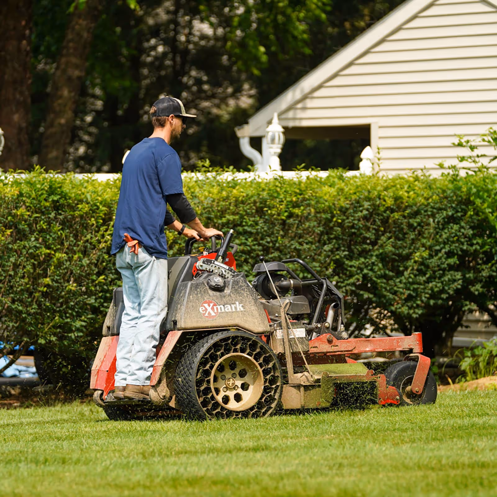Professional lawn mowing crew working Hershey PA Horse Power Lawn and Home