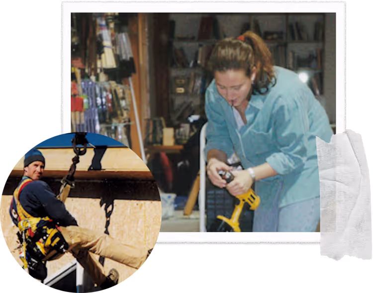 Woman in blue coat using power tool in workshop with climbing gear nearby