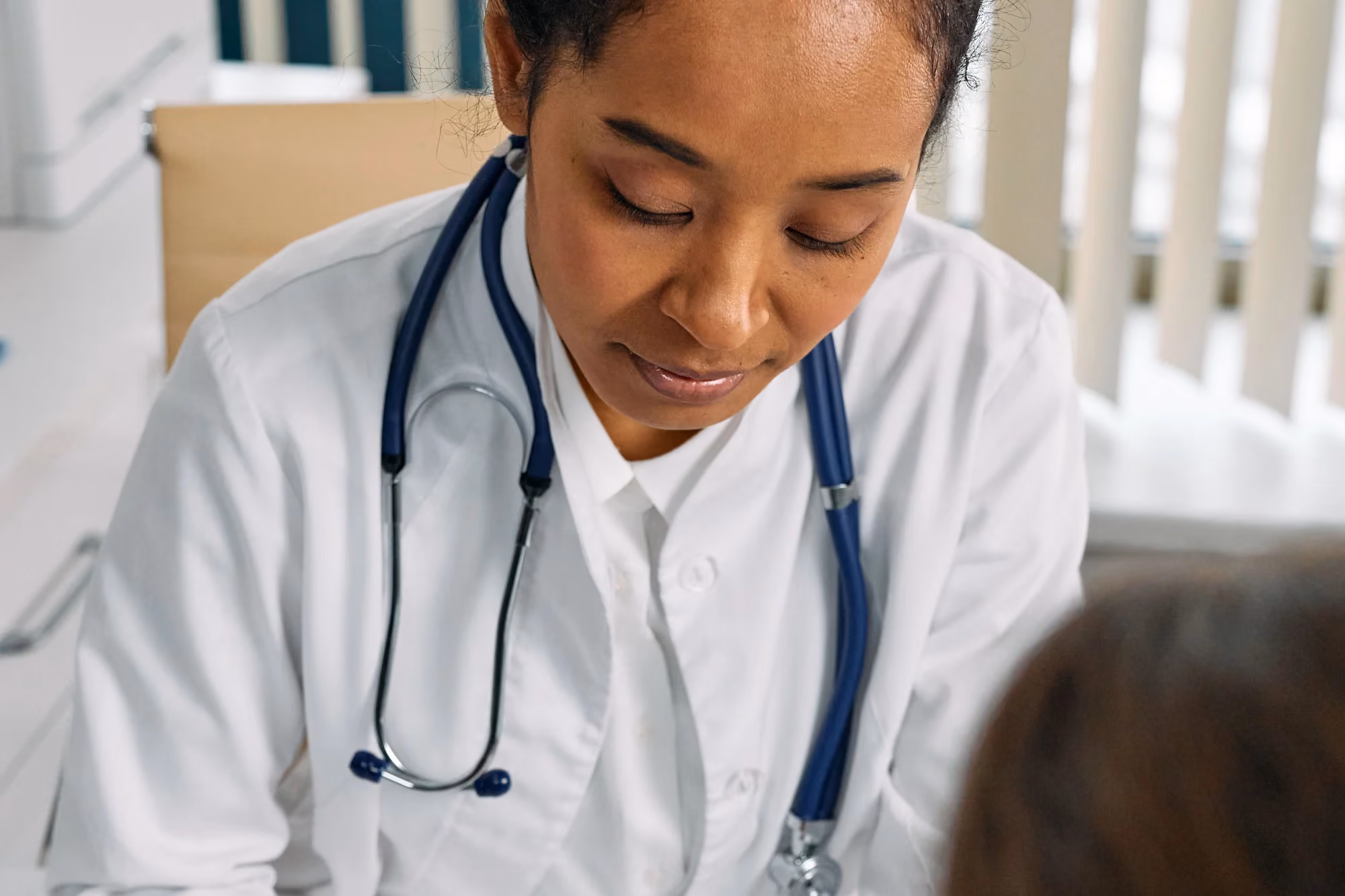 Doctor listening attentively to a patient during a consultation