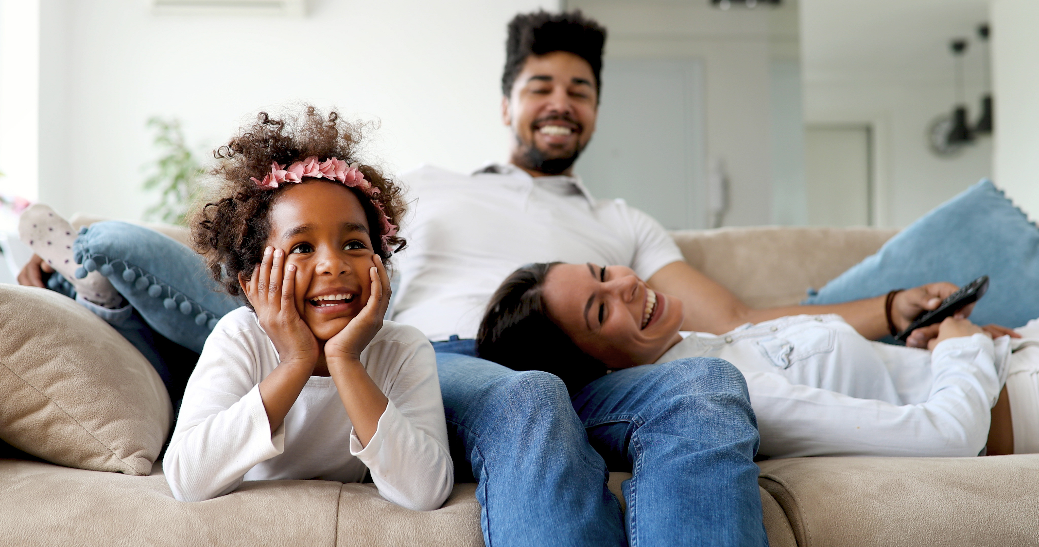 smiling on couch stock image