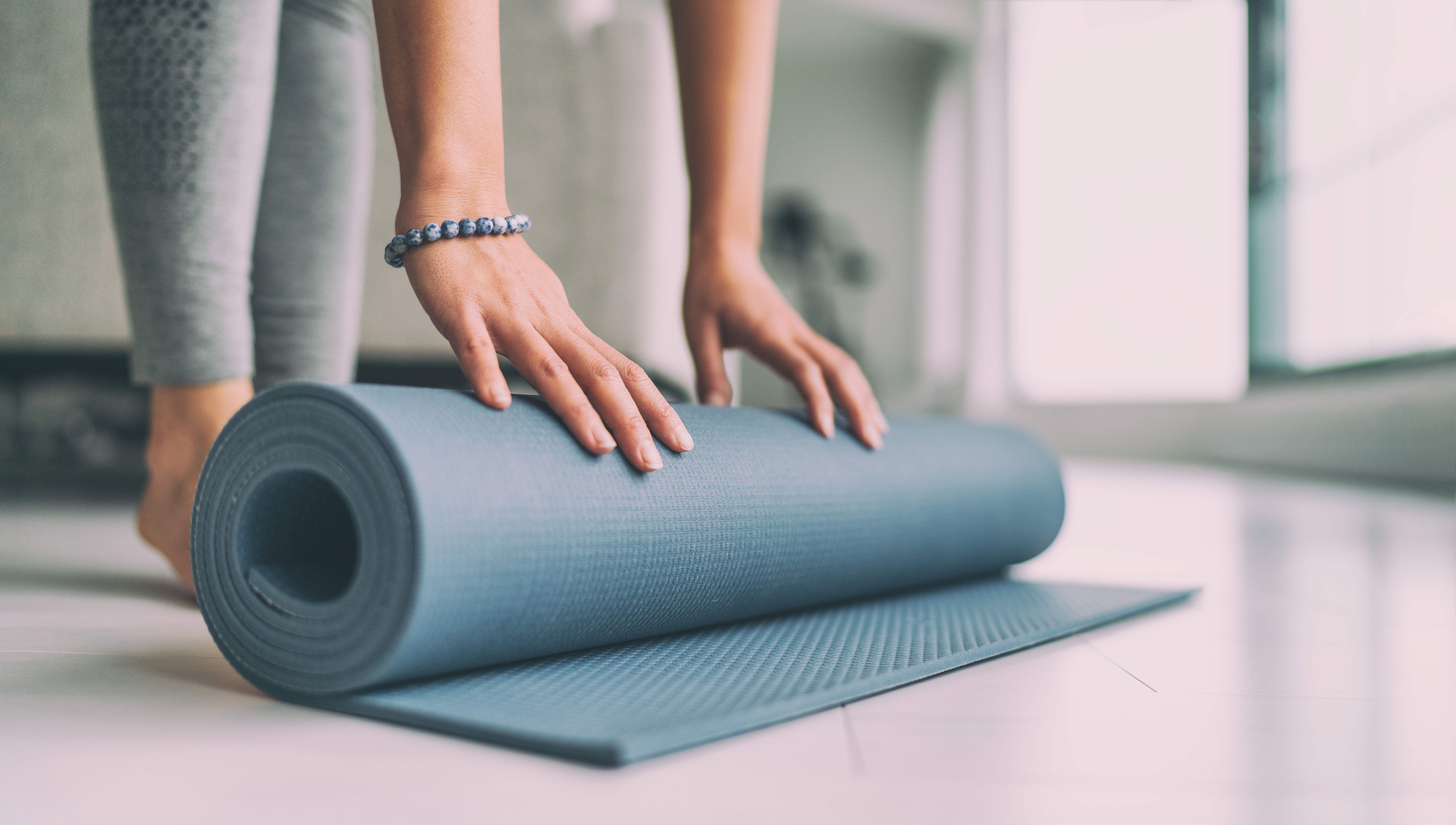 yoga mat being rolled up stock image