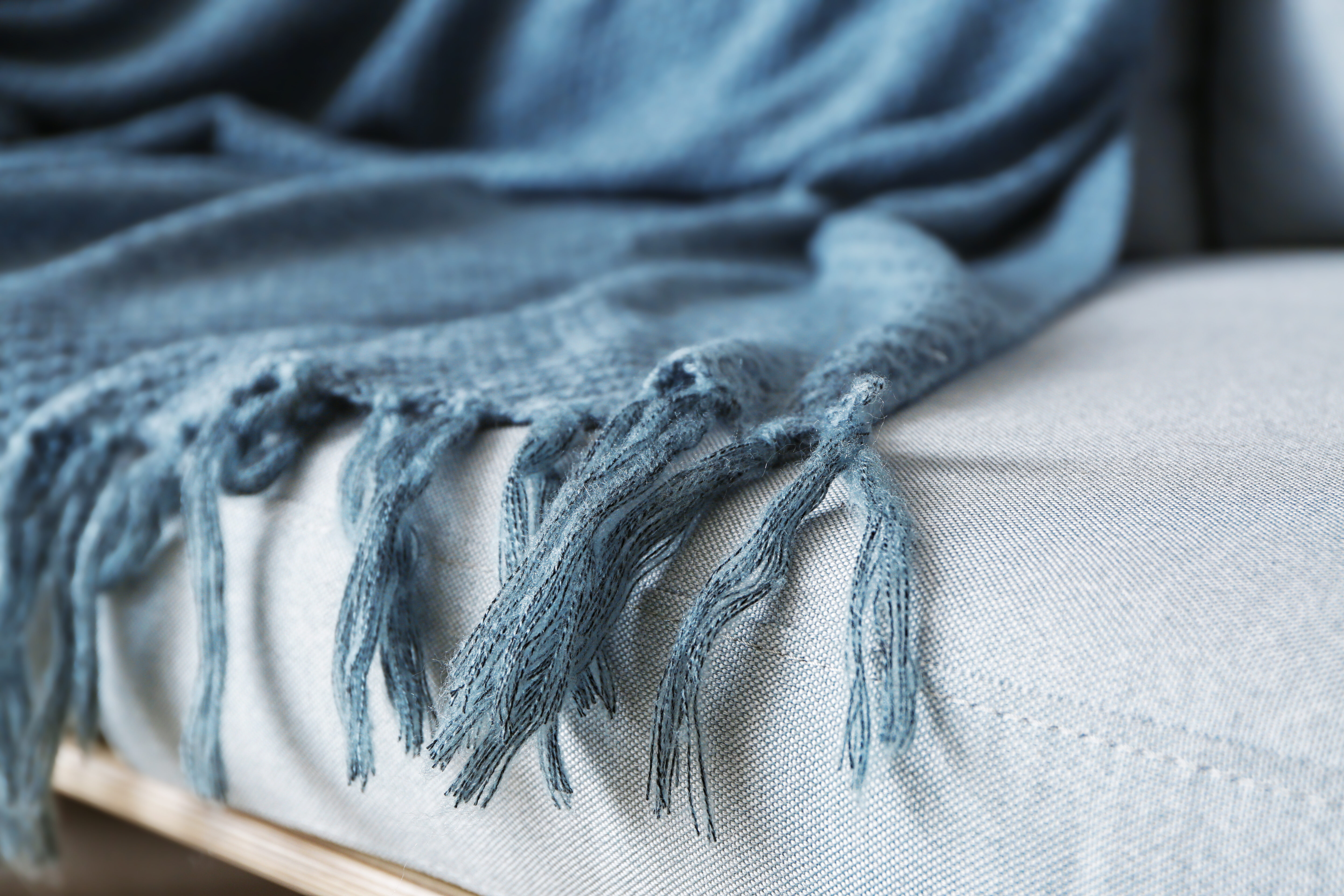 blue blanket on couch stock image