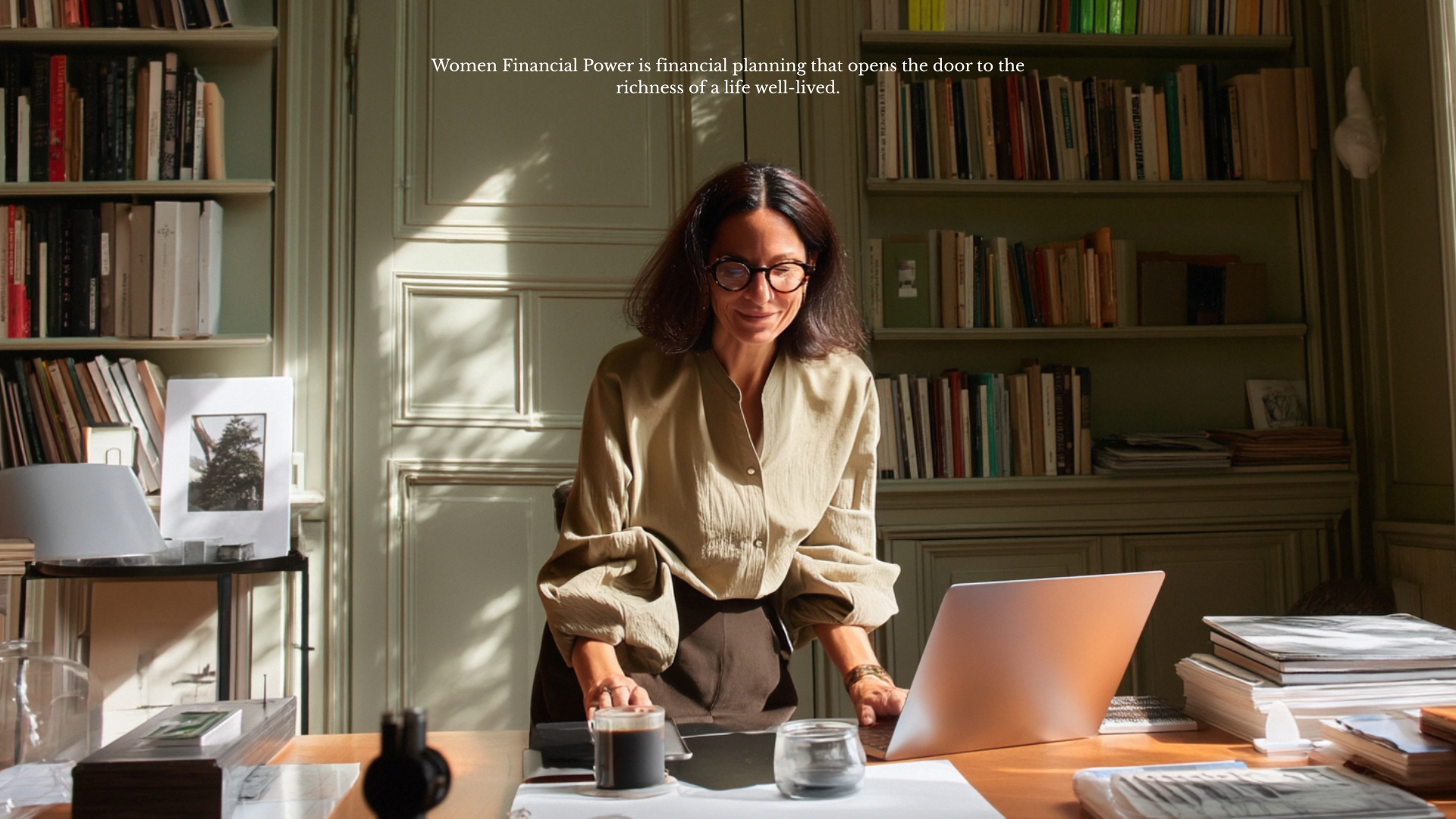 Two professional women in a bright office having a meeting and taking notes