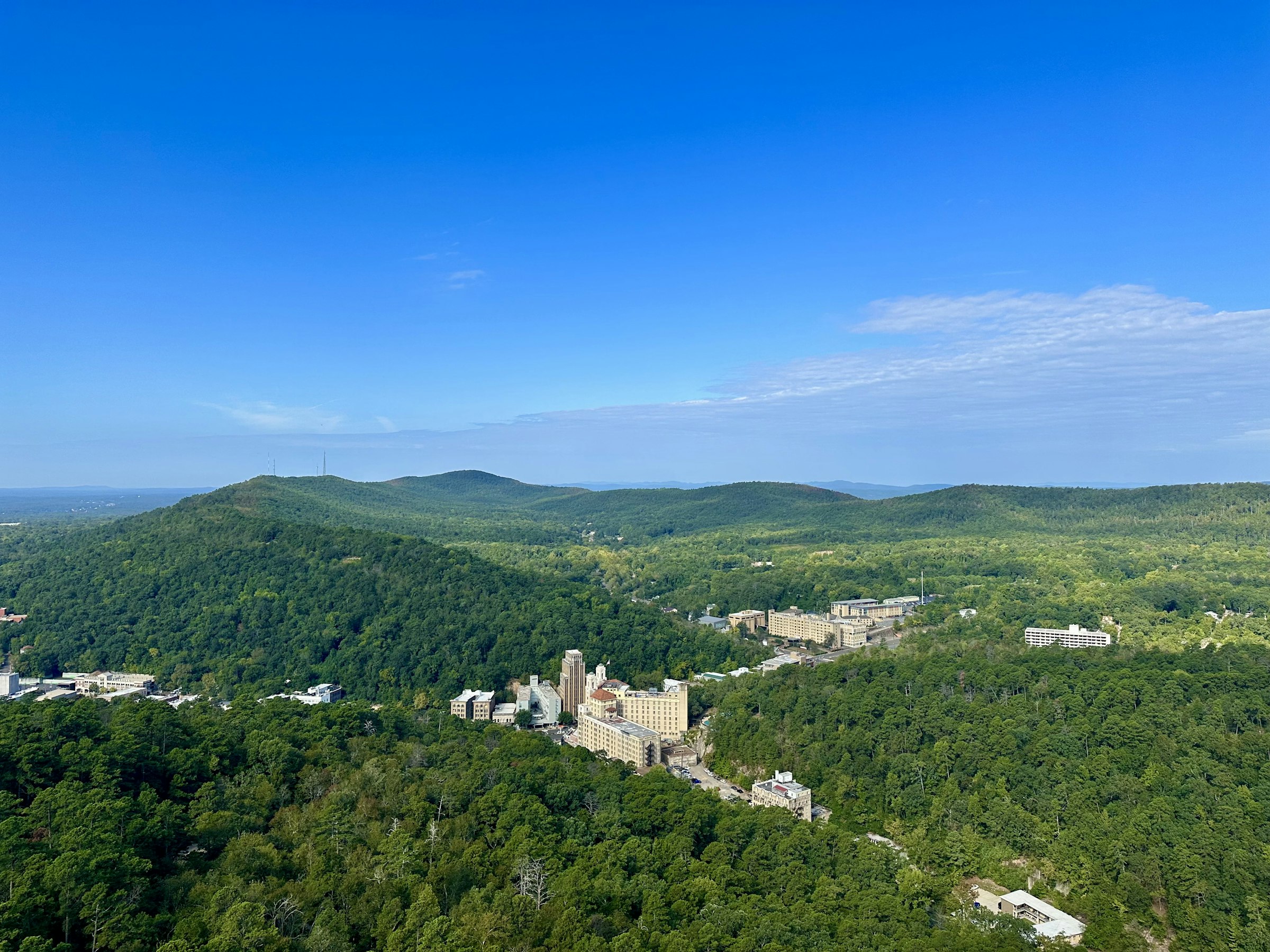 Historic downtown Hot Springs, Arkansas hotels among forested hills, seen from Hot Springs Mountain Tower