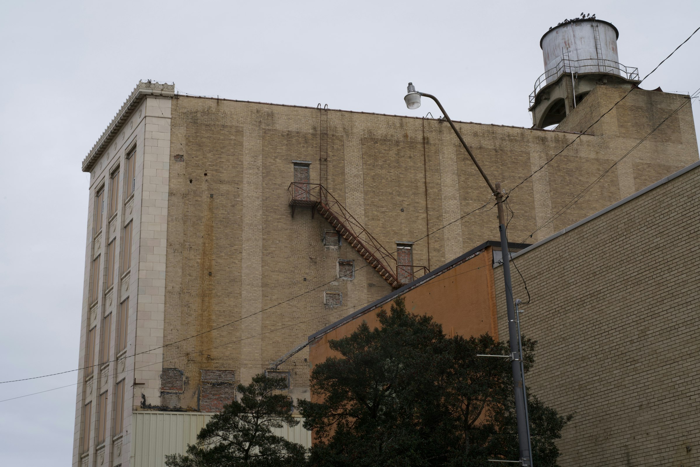 Historic downtown building with rooftop water tower in Monroe, Louisiana