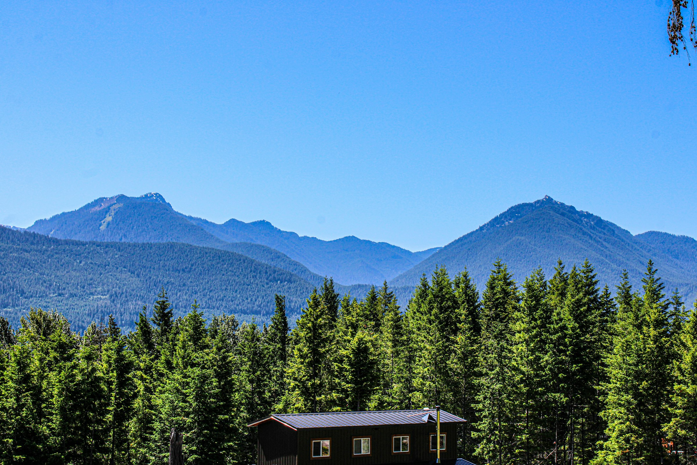 Cabin in the woods with mountains behind in Packwood, Washington near Mount Rainier