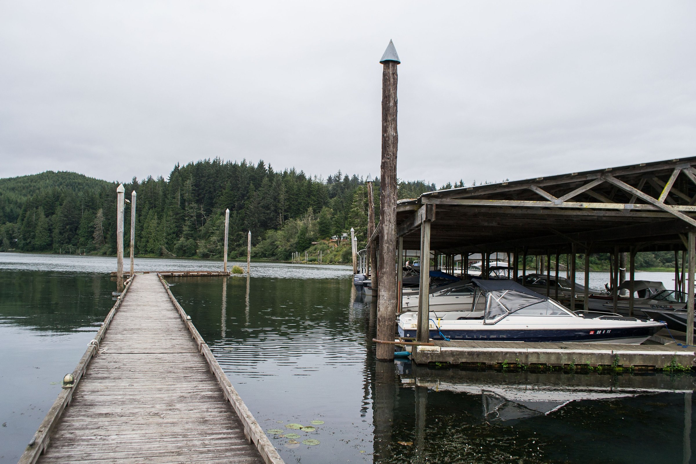 Boat dock and covered moorage on Tenmile Lake in Lakeside, Oregon