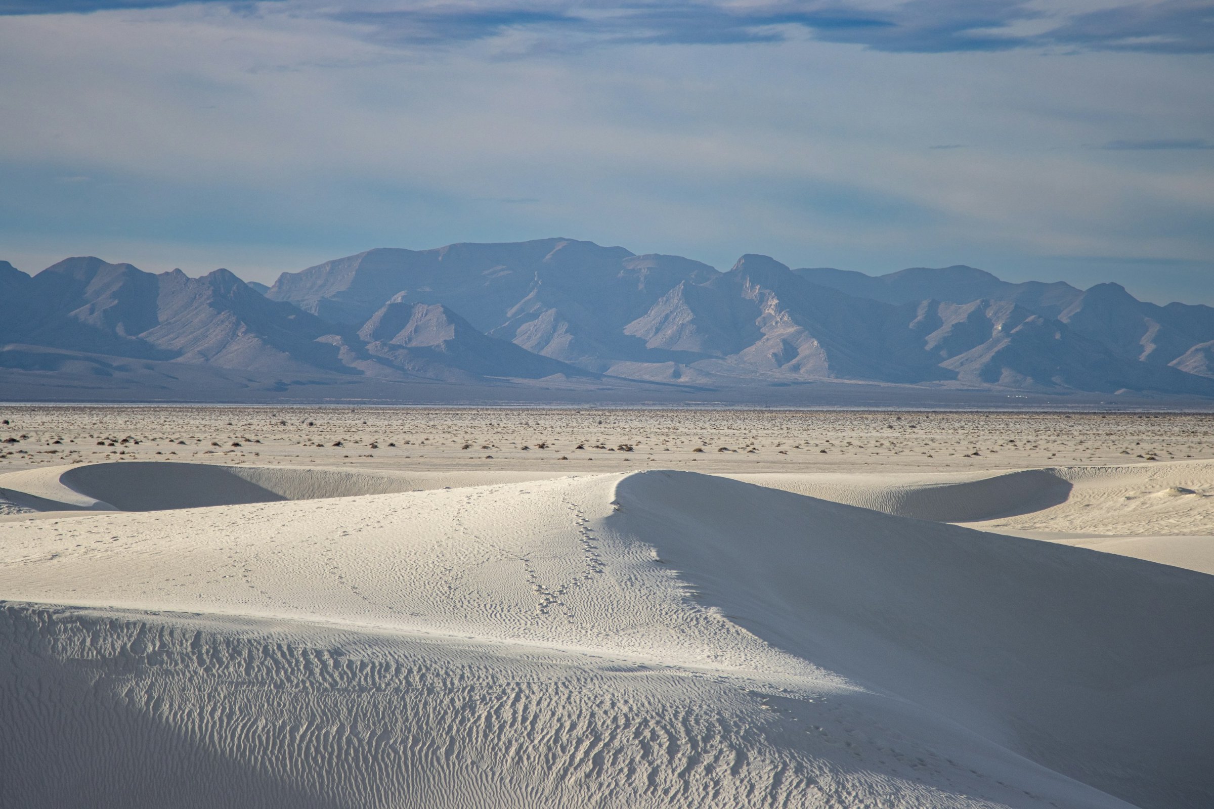 White gypsum dunes and mountains at White Sands National Park near Alamogordo, New Mexico
