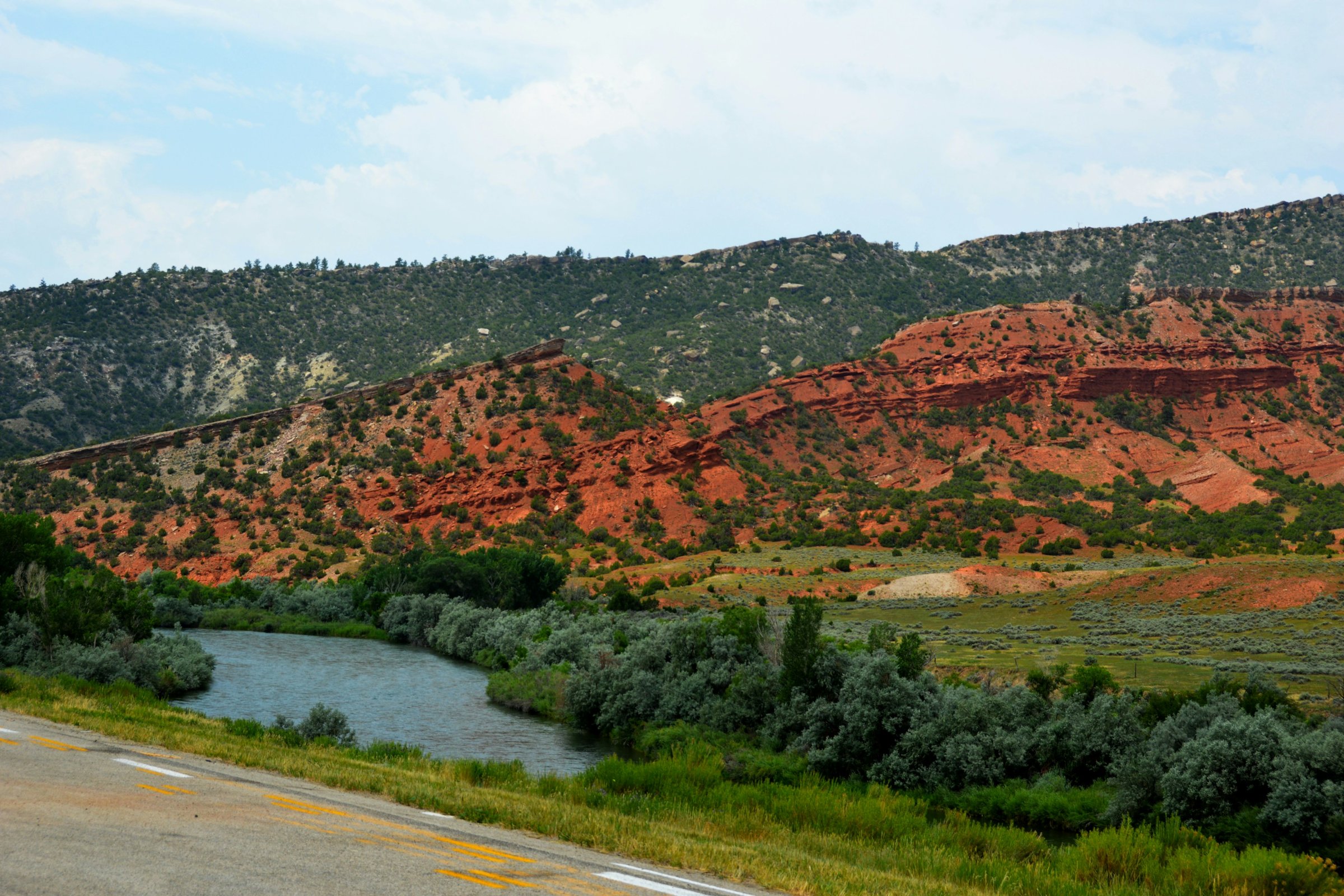Red cliffs and river valley along WY-220 near Casper, Wyoming